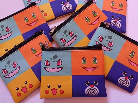 35 Porta Moedas Pokémon Tamanho: 10x12cm